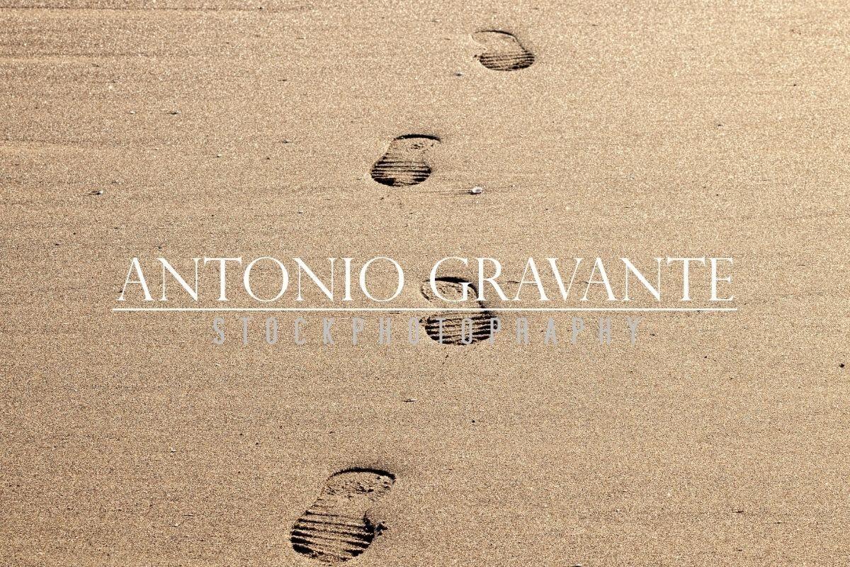 Closeup of Footprints in the Sand on the Beach
