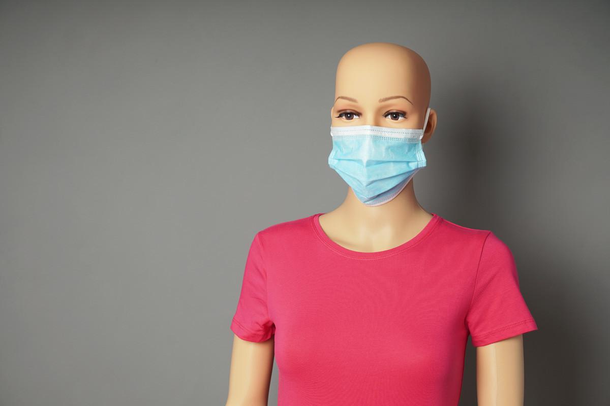 Store Window Mannequin Wearing Medical Face Mask
