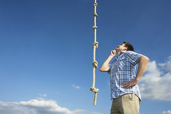A Man Looking at a Knotted Rope