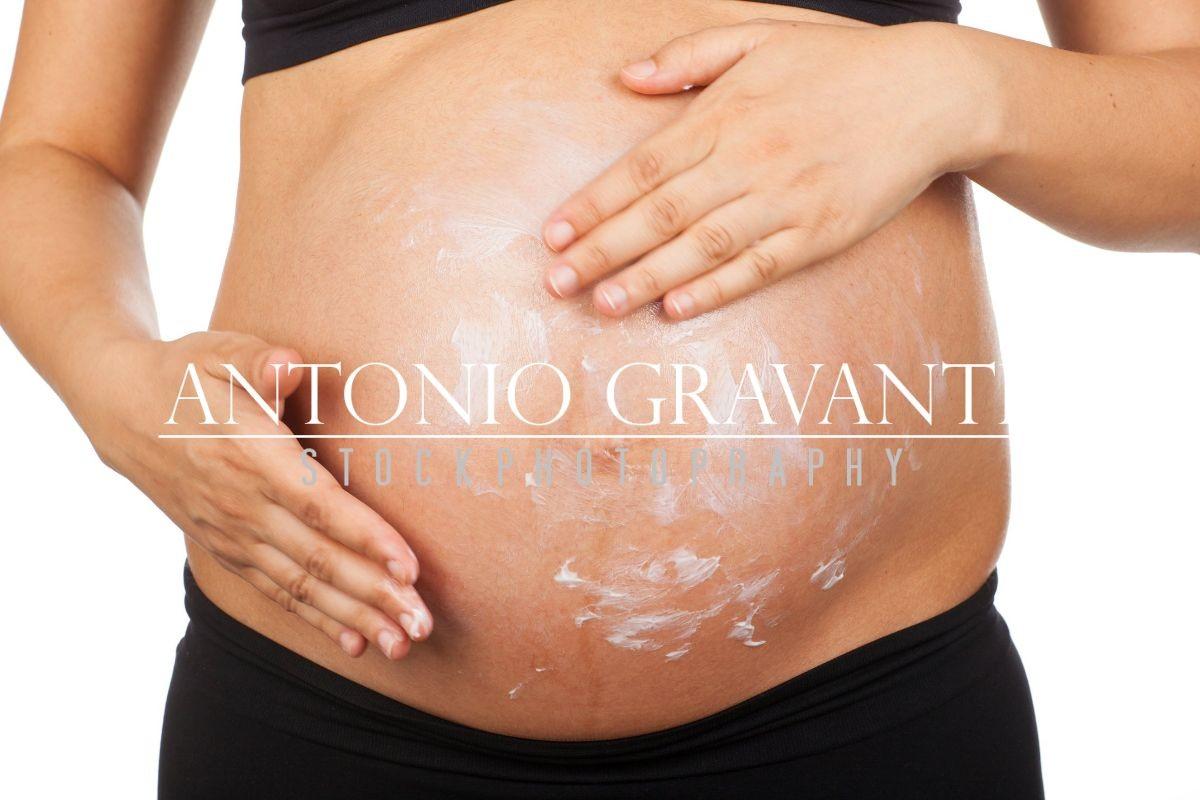 Pregnant Woman Massaging Her Belly