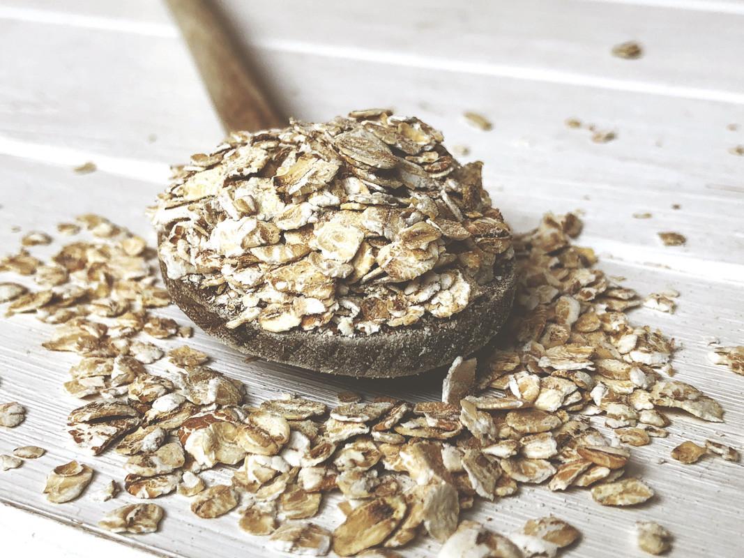 Oatmeal or Coarse Oats on Wooden Spoon