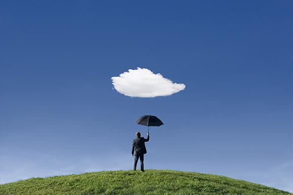 A Businessman Holding an Umbrella