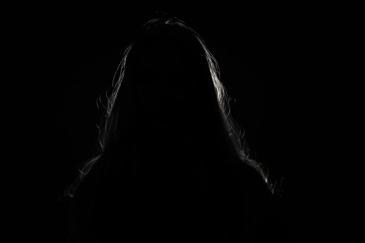 Anonymous Woman Hiding Face and Identity