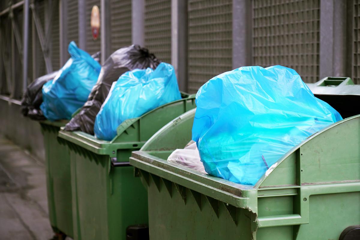 Dumpster or Refuse Container Overflowing with Trash