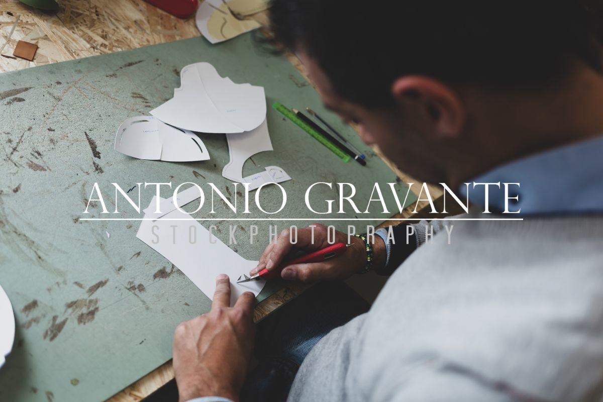Shoe Designer Working with Paper Models for Leather Cutting