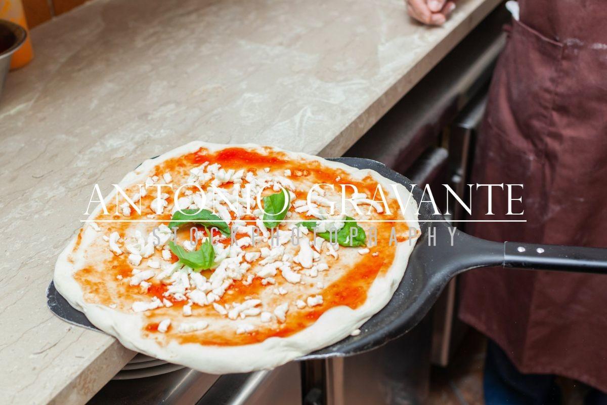 Raw Margherita Pizza on Baking Shovel