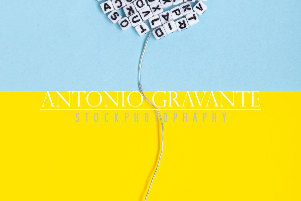 Balloon Made of Letters on a Yellow and Blue Background