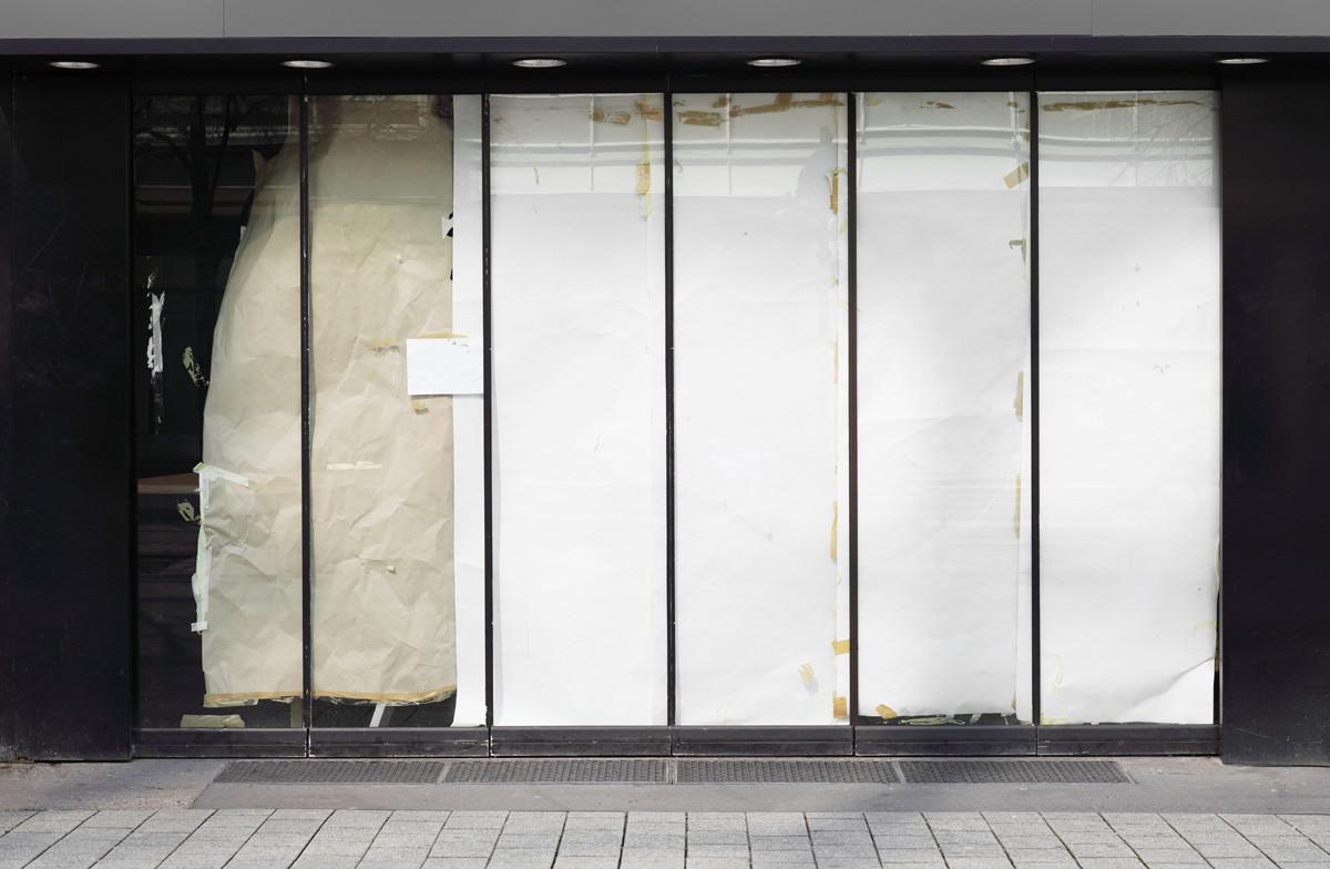 Closed or Empty Shop or Store Storefront with Blocked Windows